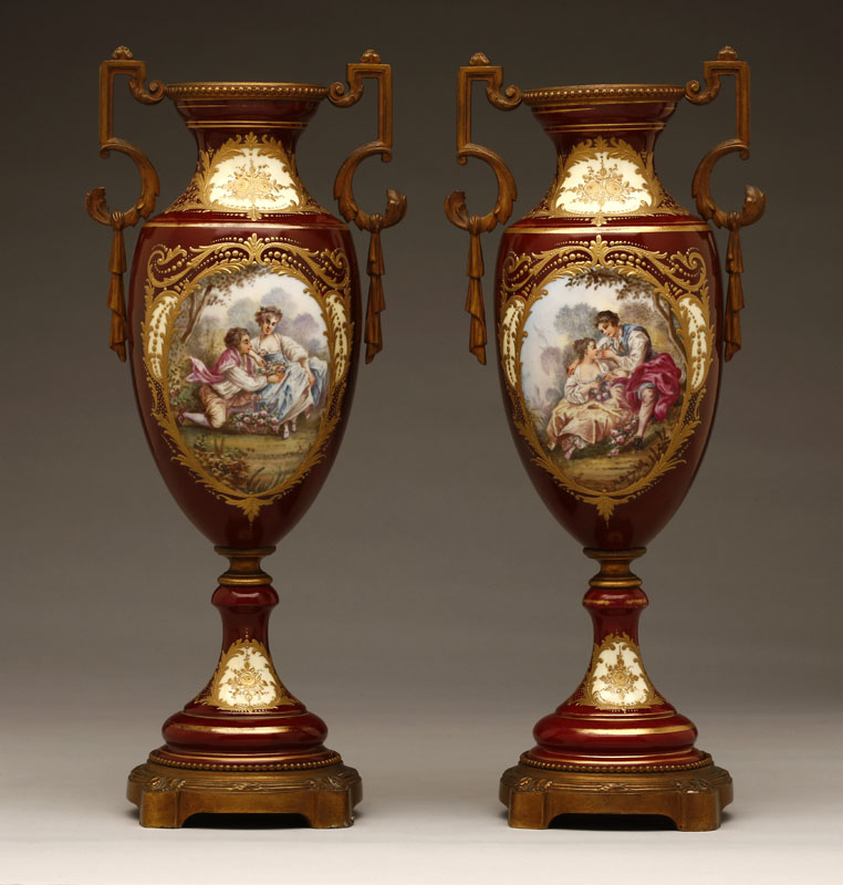 Appraisal: A pair of Paris porcelain burgundy ground bronze-mounted vases A