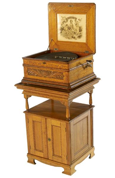 Appraisal: CRITERION Double comb oak music box on matching stand complete