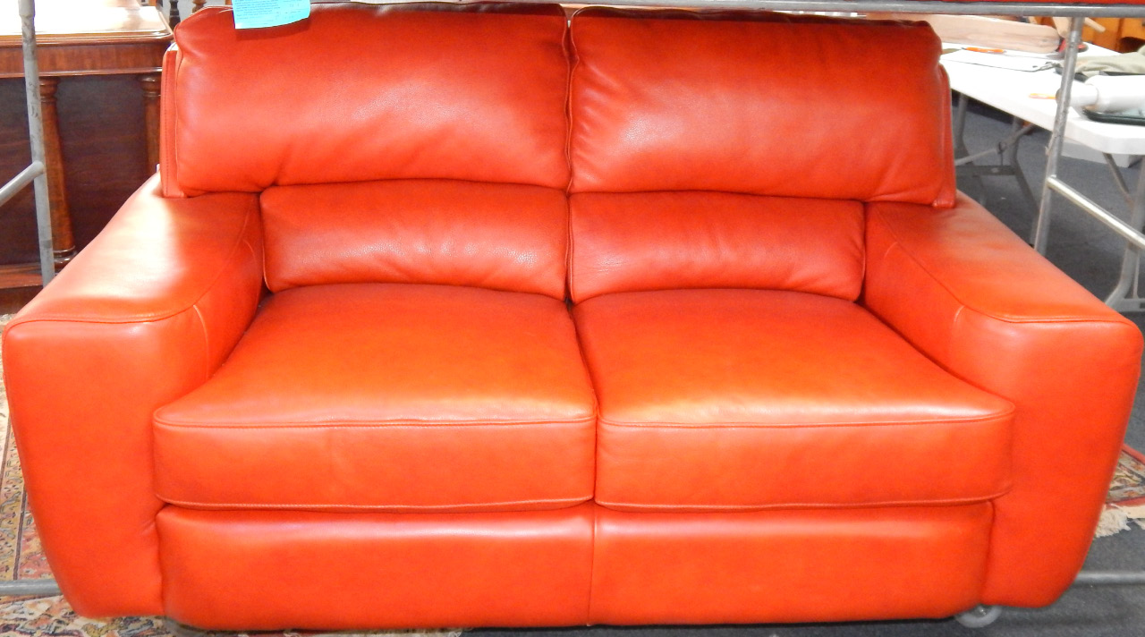 Appraisal: A red hide two seater sofa cm long cm deep