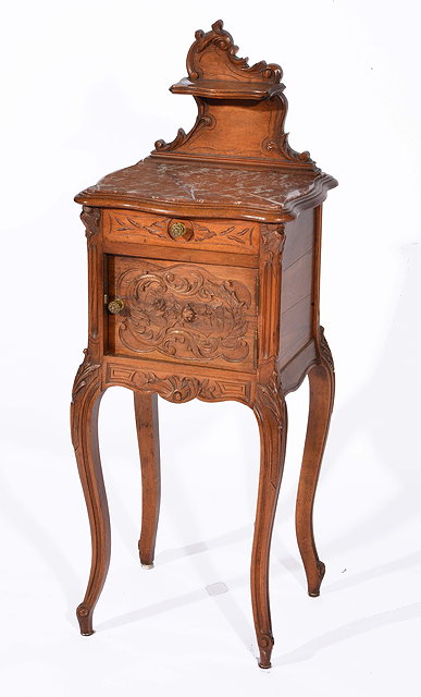 Appraisal: French carved walnut bedside cupboardwith inset marble top circa cm