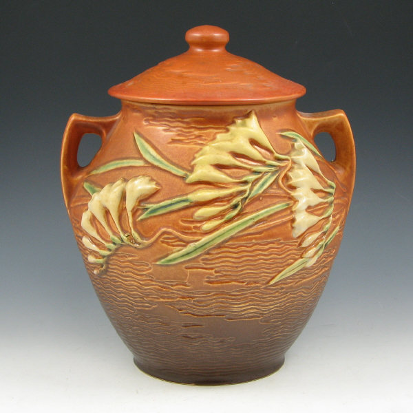 Appraisal: Roseville Freesia lidded cookie jar in brown Marked Roseville USA