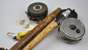 Appraisal: Two fishing rods Hardy and split cane three reels and