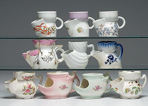 Appraisal: TEN SCUTTLE SHAVING MUGS porcelain most with polychrome painted floral