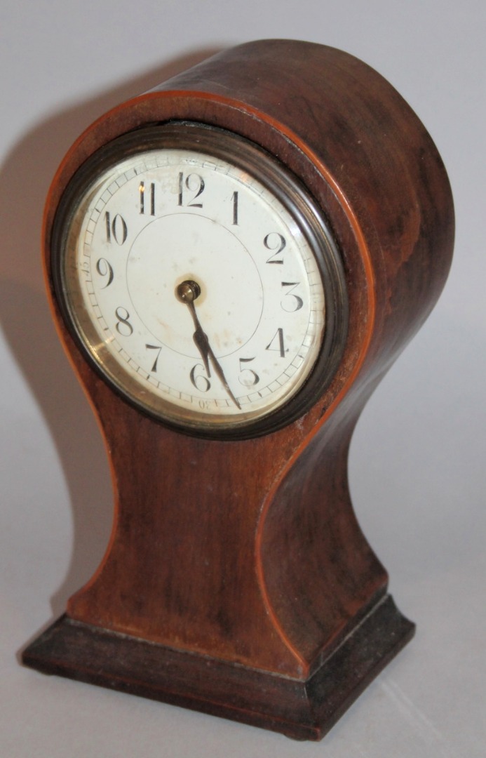 Appraisal: An Edwardian mahogany balloon clock the cm dia dial with