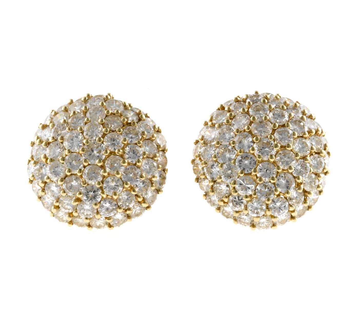 Appraisal: A pair of diamond earclips estimated total diamond weight carats