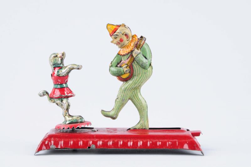 Appraisal: Rare German Tin Litho Clown Dog Penny Toy Lever-activated Depicts