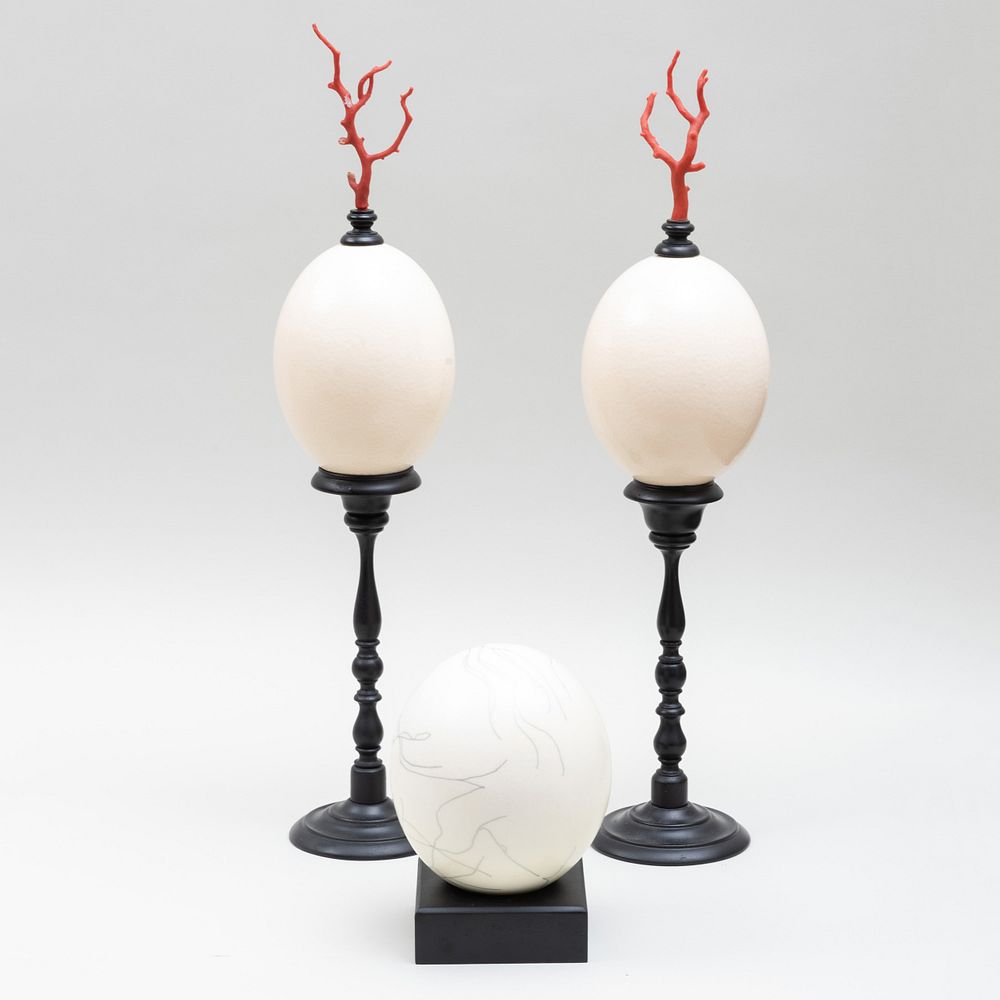 Appraisal: Pair of Ostrich Eggs on Ebonized Mounts and Another Ostrich