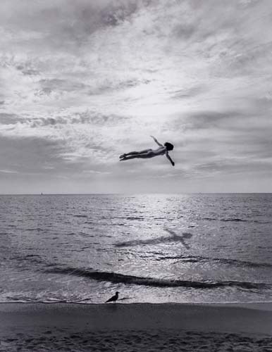 Appraisal: UELSMANN JERRY - Untitled Woman in Flight Over Ocean Silver