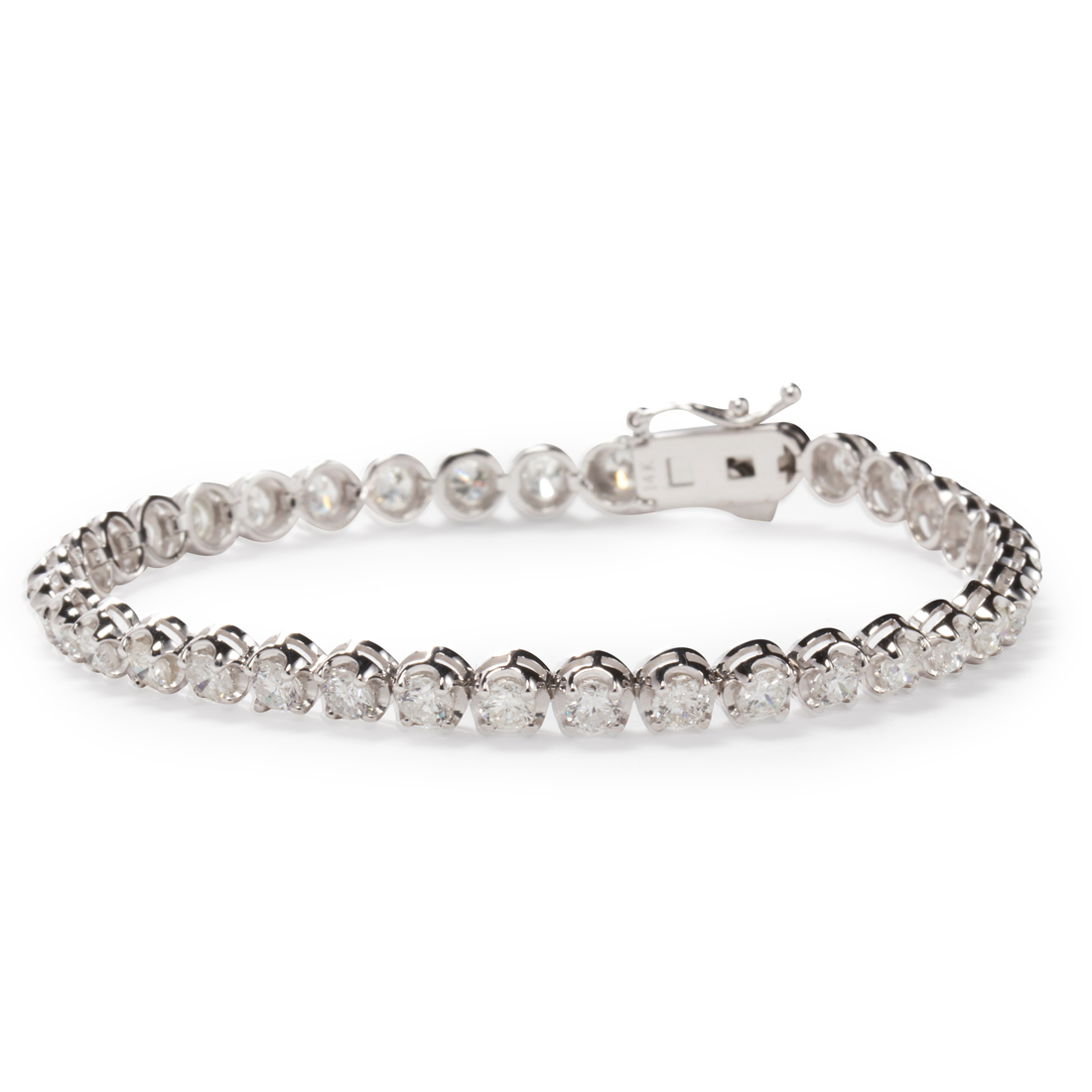 Appraisal: A DIAMOND AND FOURTEEN KARAT WHITE GOLD BRACELET A diamond