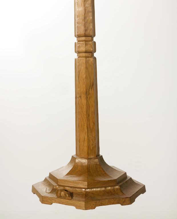 Appraisal: ROBERT MOUSEMAN THOMPSON OAK STANDARD LAMP c the tapering octagonal-section