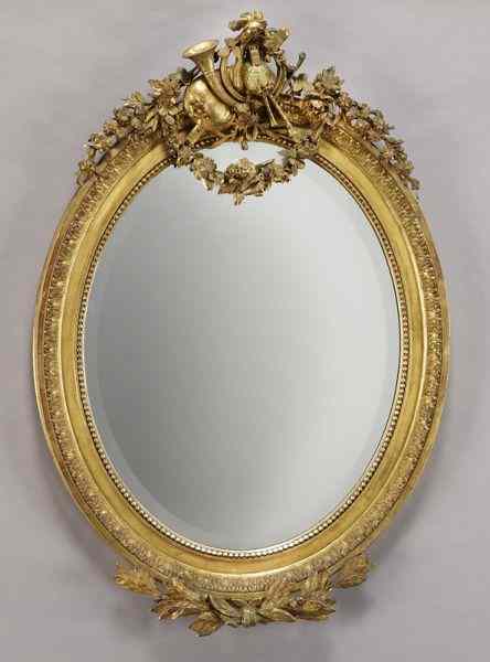 Appraisal: Belle Epoque gilt framed oval beveled mirror the top with