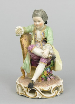 Appraisal: A Charming Meissen Figurine of a Seated Young Man Traditionally