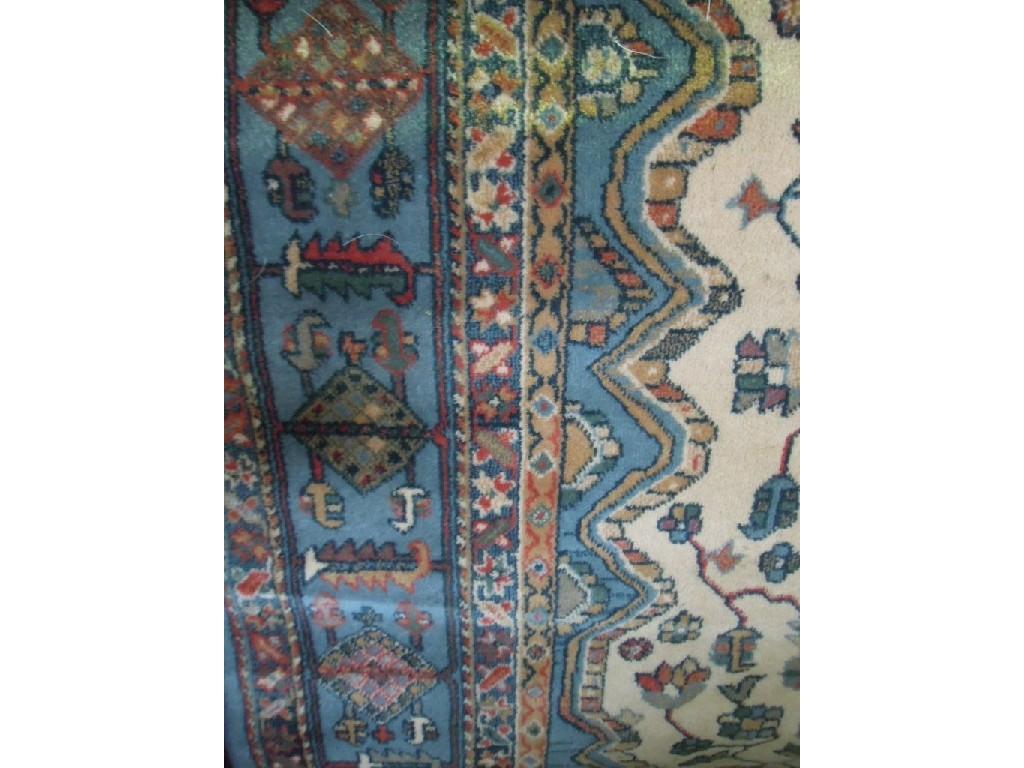 Appraisal: A large Indian style carpet with a central cream medallion