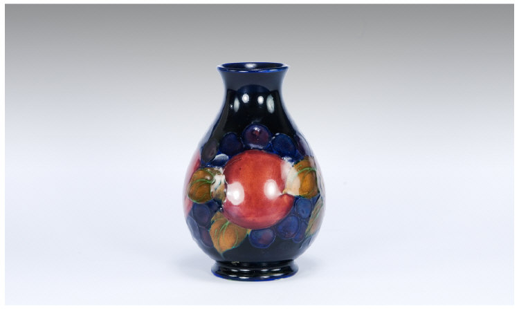 Appraisal: Moorcroft Pottery Pomegranate Pattern Vase of Baluster Form Decorated with