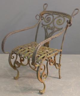 Appraisal: Wrought iron armchair Ornate Victorian wrought iron garden armchair h