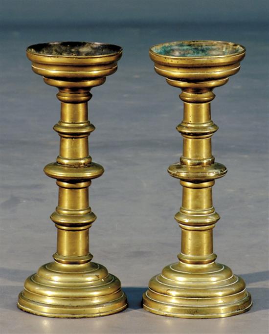 Appraisal: Pair of brass candlesticks early th centurystepped socket with shaped