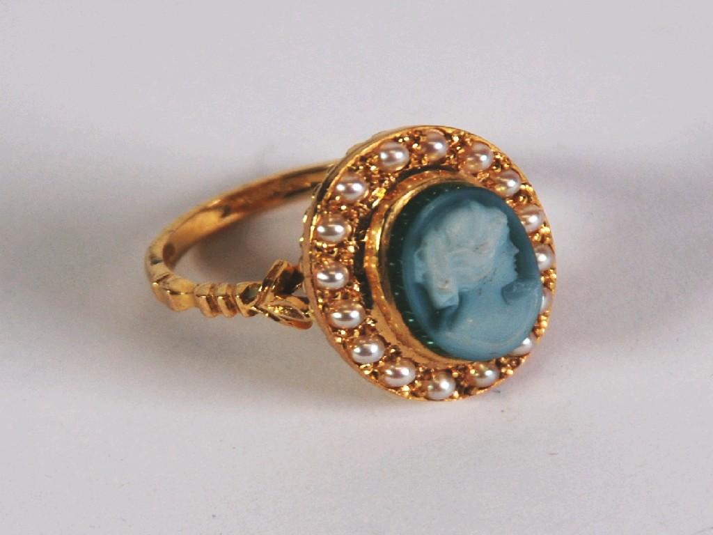 Appraisal: ct GOLD RING SET WITH AN OVAL CARVED BLUE AND