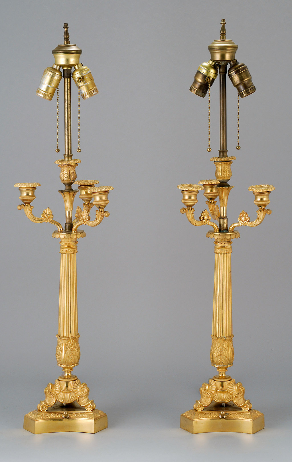 Appraisal: PAIR OF ORMOLU BRONZE CANDELABRA Early th CenturyWith four socles