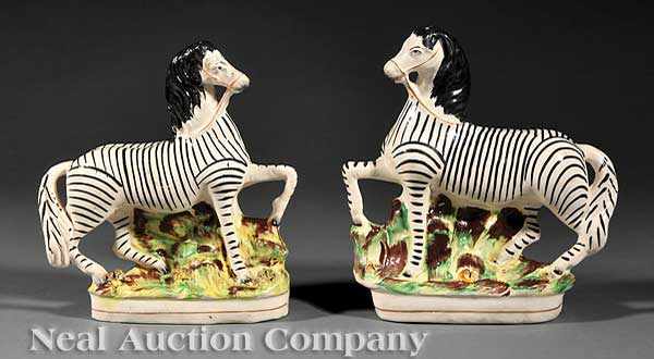 Appraisal: A Pair of English Staffordshire Pottery Zebras th c with