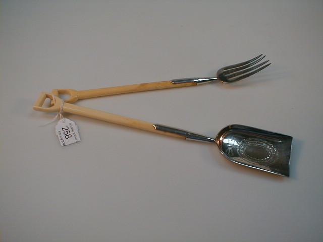 Appraisal: A pair of Victorian ivory handled miniature garden fork and