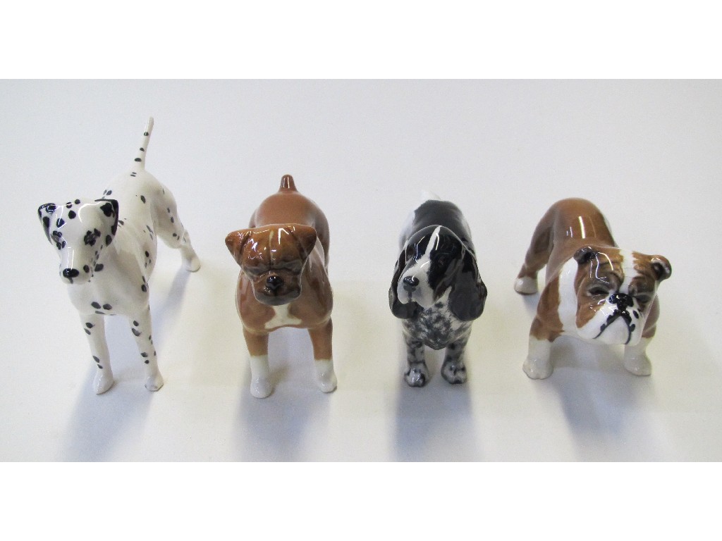 Appraisal: Four Beswick dogs including Bulldog Bosun Dalmatian Spaniel and Boxer