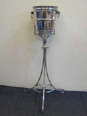 Appraisal: An Elkington plate champagne bucket with ring handles and tripod