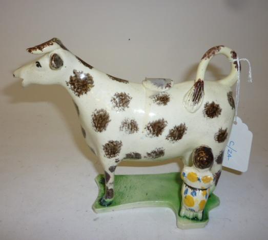 Appraisal: A PRATTWARE COW CREAMER AND COVER early th century the