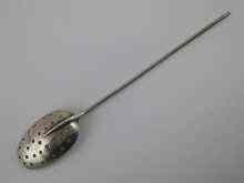 Appraisal: A William III silver mote spoon with applied wire stem