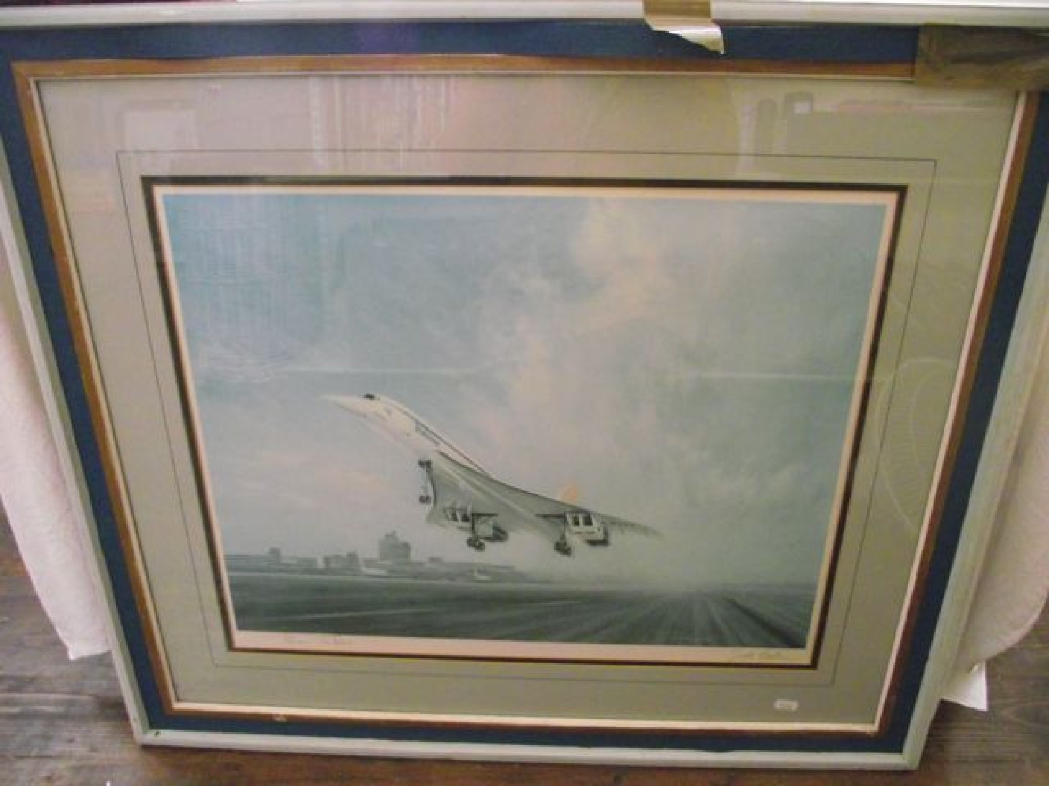 Appraisal: A signed coloured print after Gerald Coulson showing Concorde taking