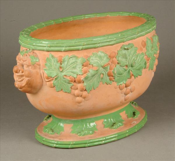 Appraisal: A Davenport Terra-cotta oval wine cooler moulded in relief with