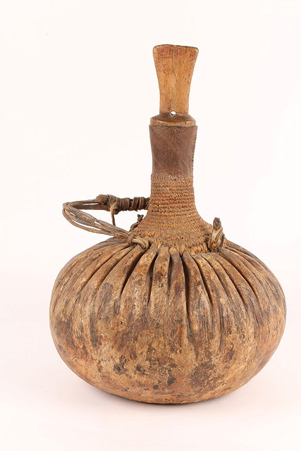 Appraisal: A TURKANA TRIBE CAMELS MILK CONTAINER with rope work decoration