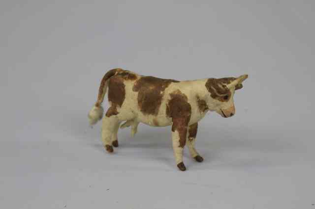 Appraisal: WHIMSICAL GURNSEY COW COTTON ORNAMENT Germany pressed and spun cotton