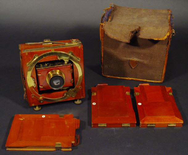 Appraisal: Mahogany and brass folding camera in a felt lined canvas