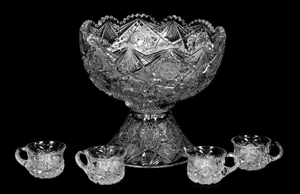 Appraisal: Two piece punchbowl and stand with four cups Well cut