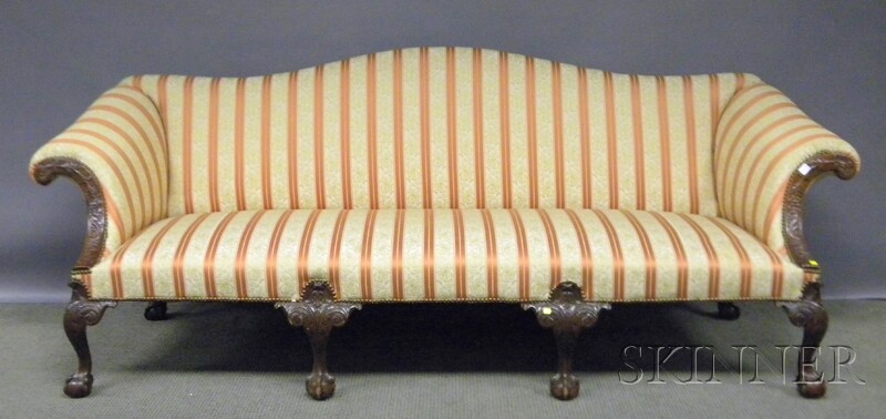 Appraisal: George III-style Upholstered Camel-back Carved Mahogany Sofa with Ball-and-claw Feet