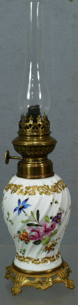 Appraisal: Porcelain oil lamp with swirled body hand painted and floral