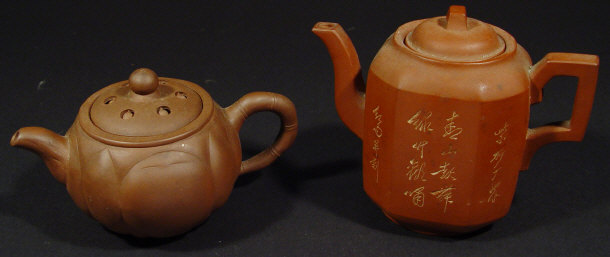 Appraisal: Two Chinese terracotta teapots one incised with script the other