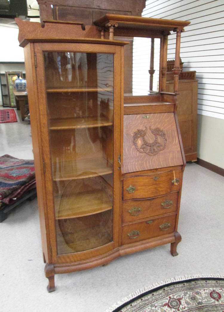 Appraisal: AN OAK SECRETARY BOOKCASE American late th century the left