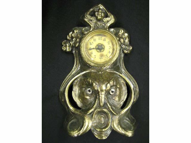 Appraisal: Art Nouveau Bronzed Clock with Maiden owl glass eyes working