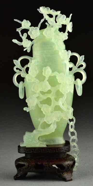 Appraisal: Chinese Celedon Jade Vase And CoverA finely carved vase and