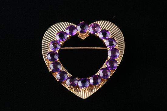 Appraisal: K YELLOW GOLD AND AMETHYST HEART PIN Ribbed openwork heart