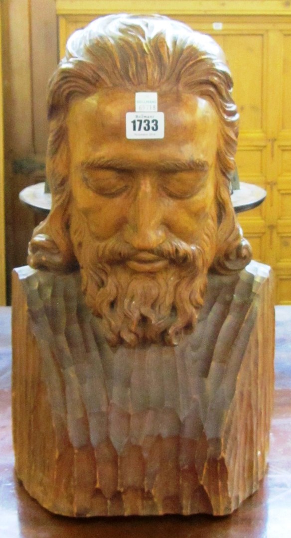 Appraisal: A carved pine bust early th century probably Jesus modelled