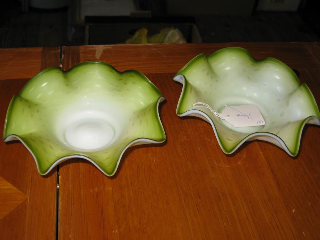 Appraisal: A pair of Victorian satin green glass bowls with undulating