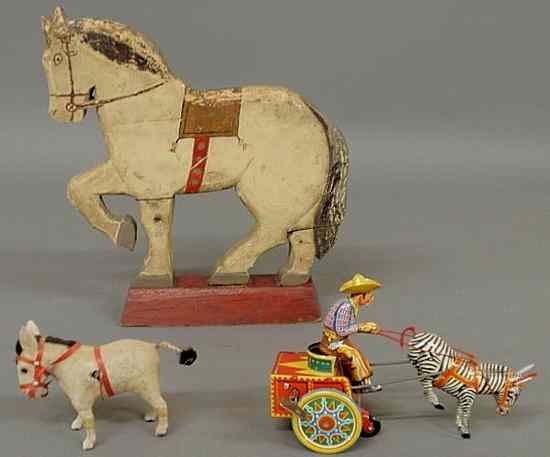 Appraisal: Paint decorated wood flat horse figure h and two wind-up