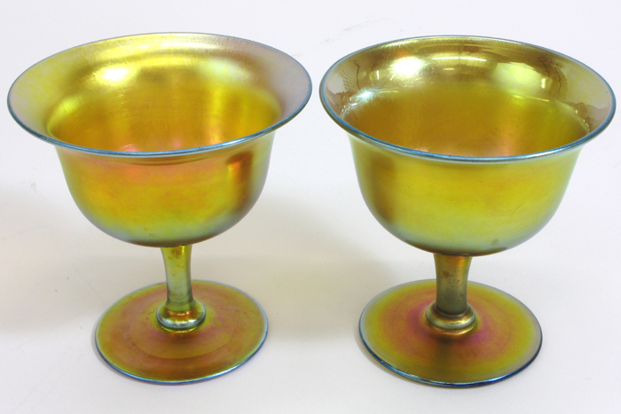 Appraisal: TWO STEUBEN GOLD AURENE ART GLASS GOBLETS reflecting violet-red Diameters