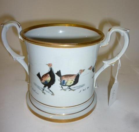 Appraisal: A STAFFORDSHIRE EARTHENWARE LOVING CUP early Victorian of slightly waisted