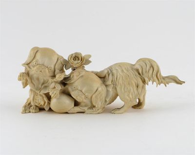 Appraisal: A Japanese ivory of two Pekenese puppies playing with roses