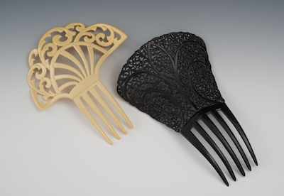 Appraisal: Two Pierced Celluloid Ornamental Hair Combs The first in black