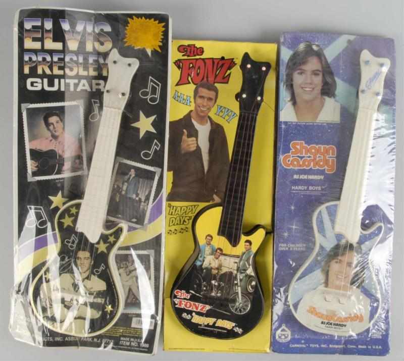 Appraisal: Lot of Vintage Character Guitar Toys Description Circa s to