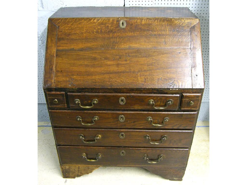 Appraisal: Small th century oak bureau the fall-front enclosing an arrangement